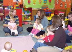 ECFE classroom  teachers sitting on floor with students